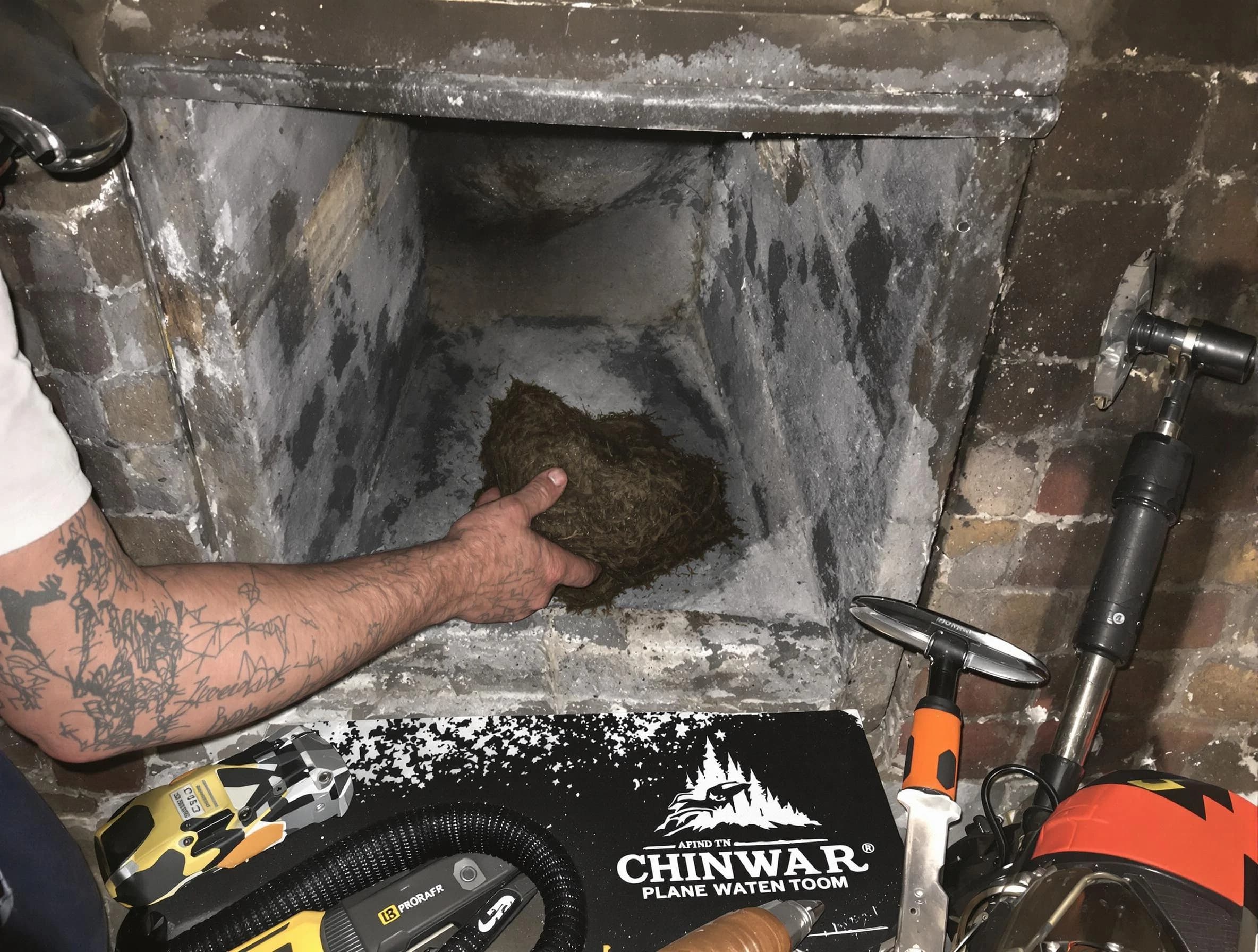 Layton Chimney Sweep safely removing debris and screening chimney in Layton, UT